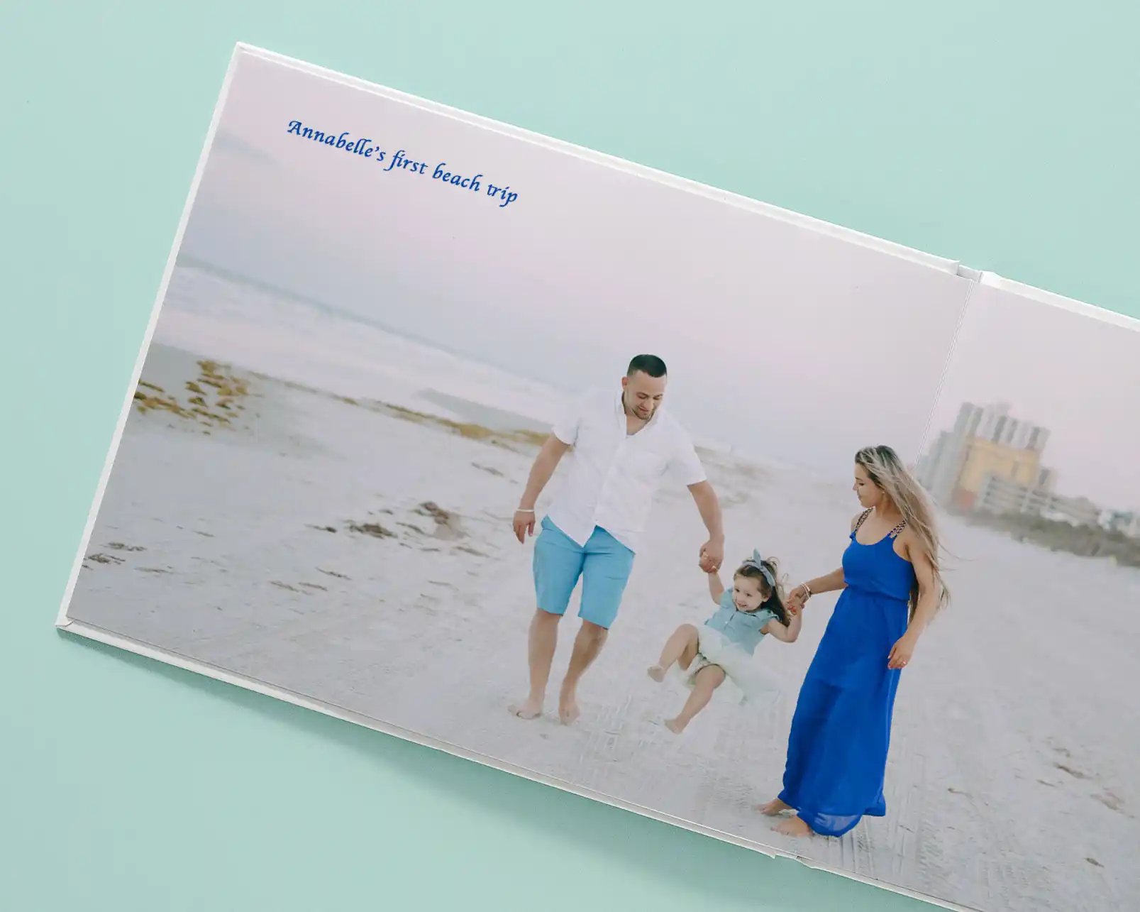 Custom layflat photo book featuring a photo of a family on a beach trip.