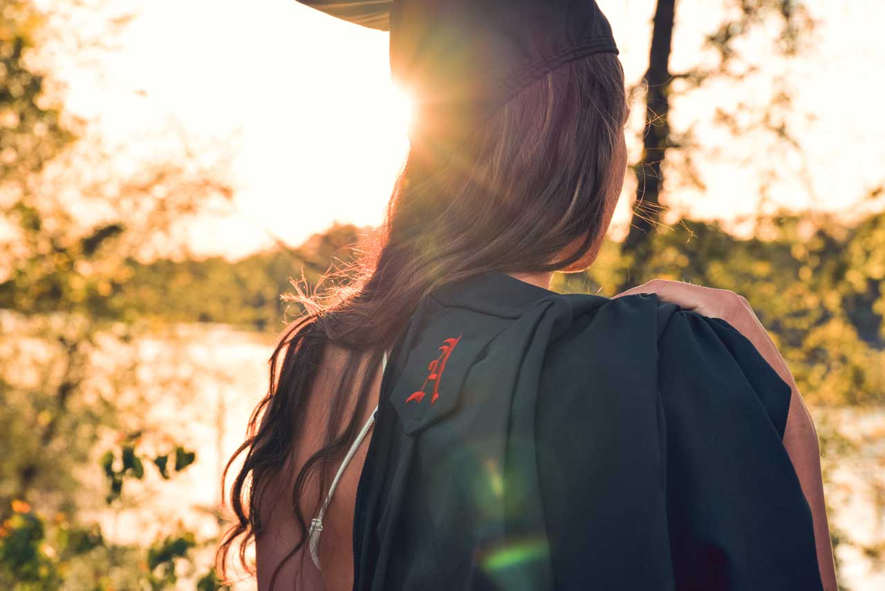 Graduate from Alabama University facing away from camera