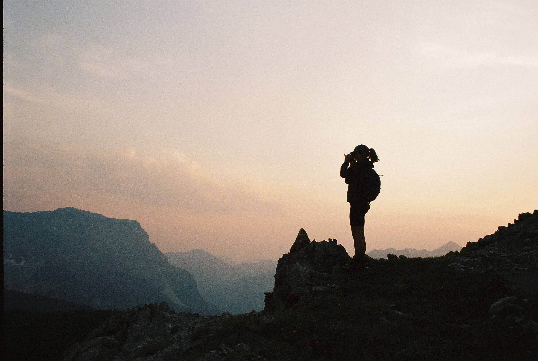 woman standing on a mountain