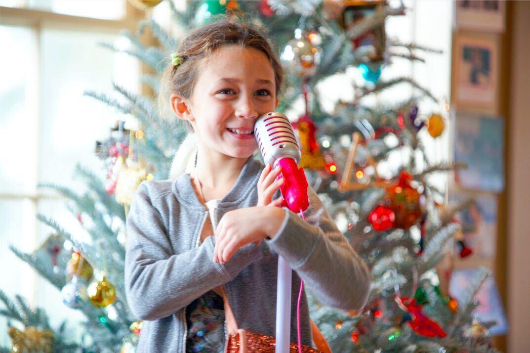 Trees and lights make great backdrops to holiday pictures