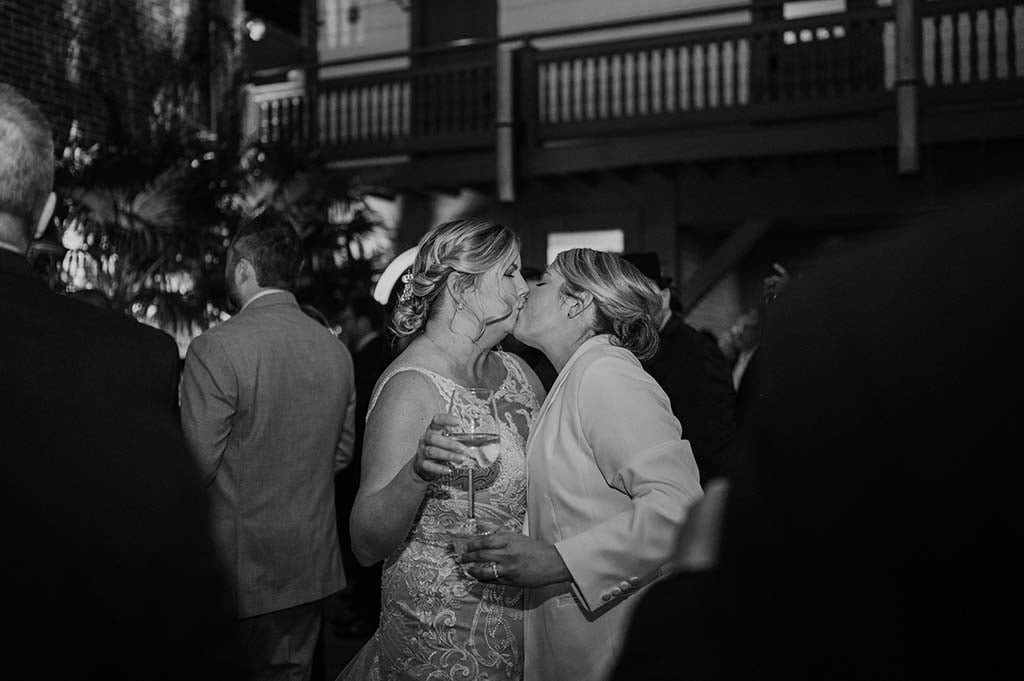 gay couple kissing at their wedding