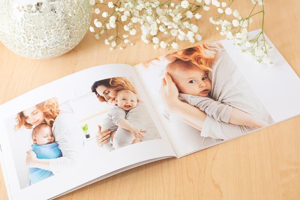 Softcover photo book laying open on a table.