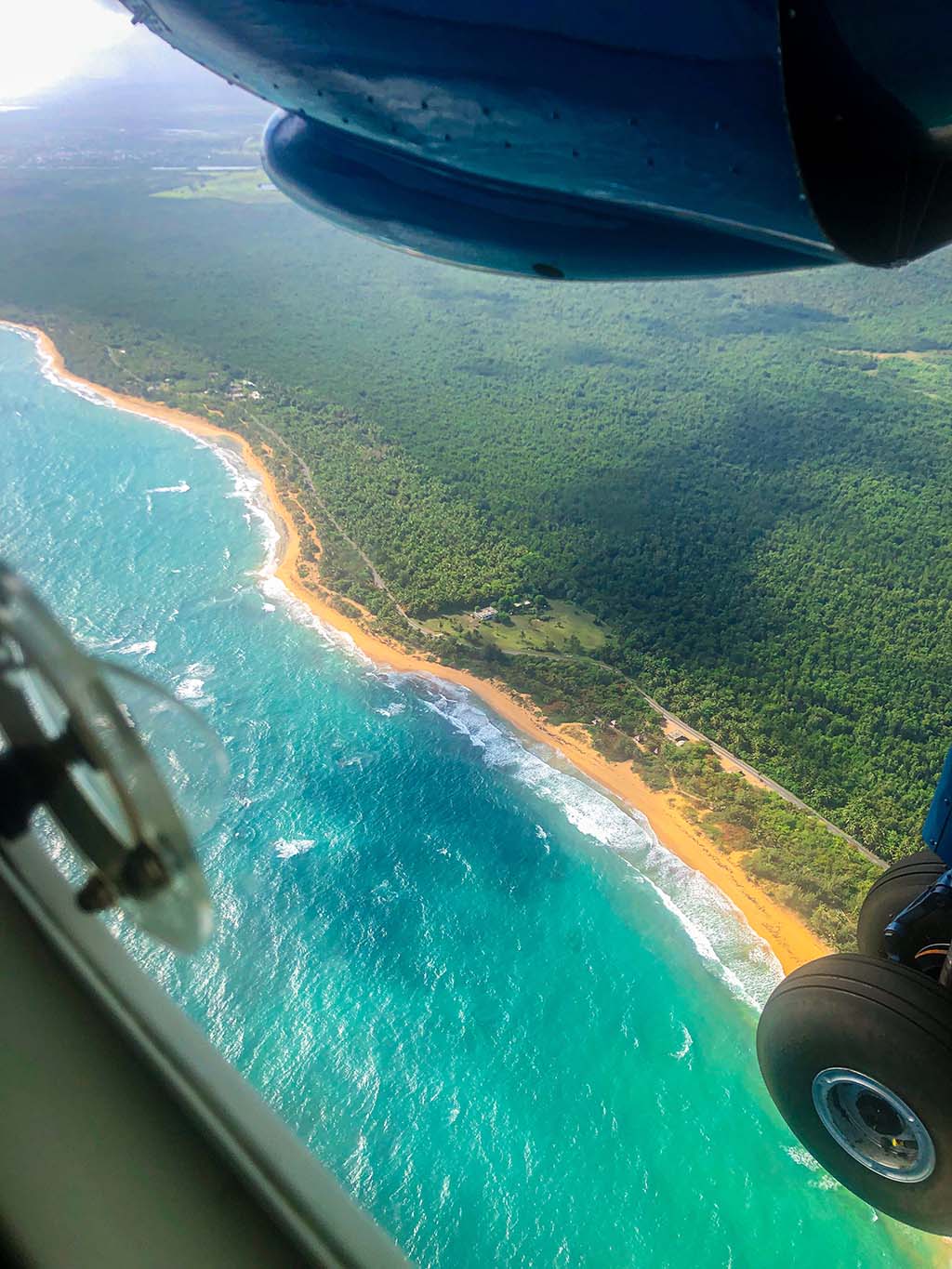 plane flying over island